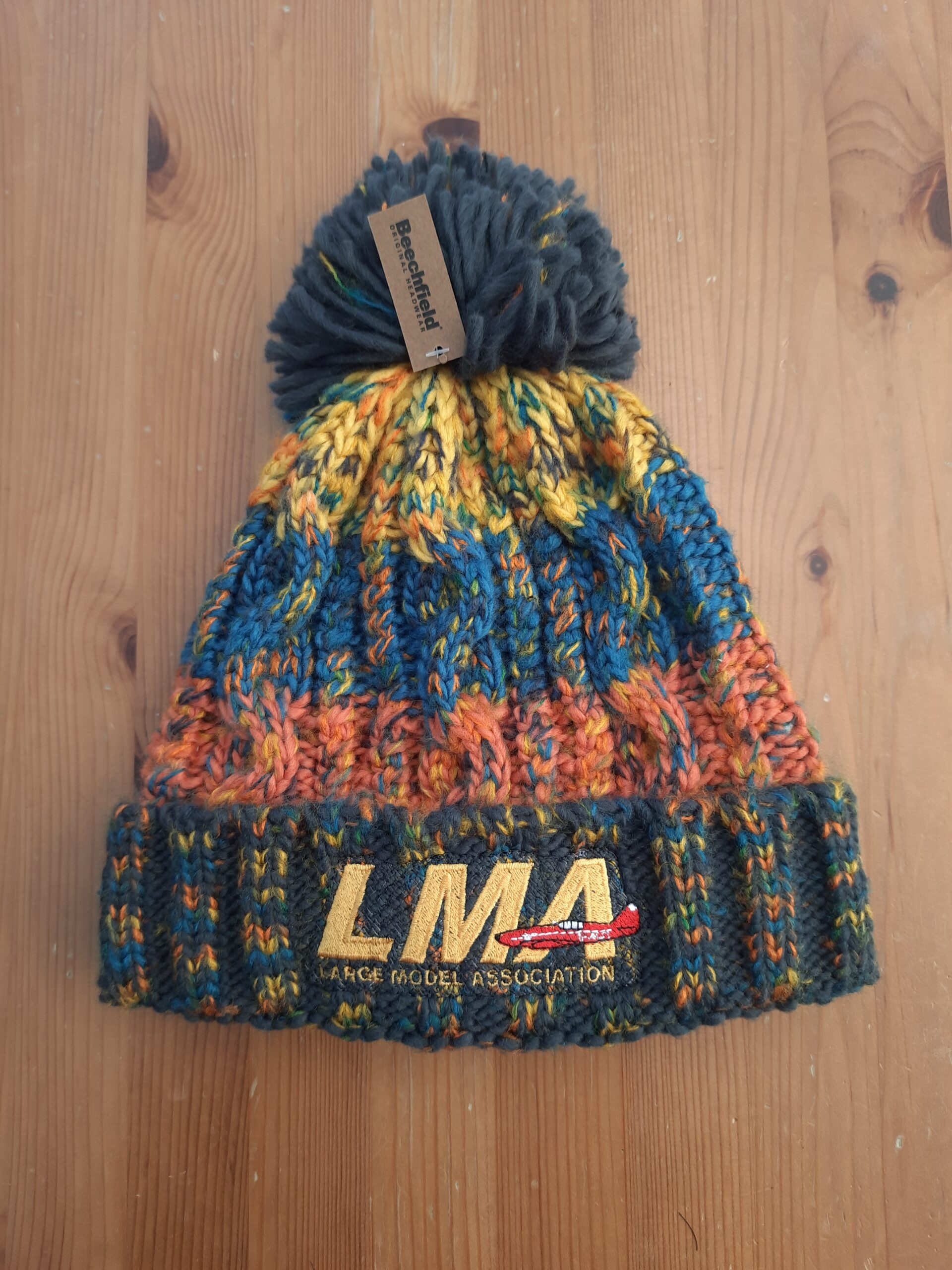LMA Embroidered Corkscrew Pom Pom Beanie